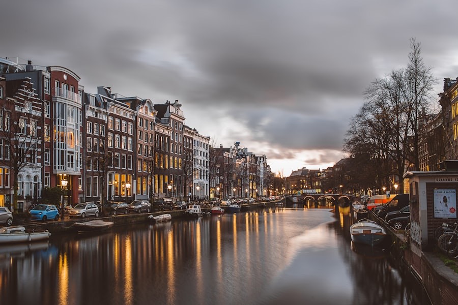 Amsterdam canal at dusk with reflected canal houses